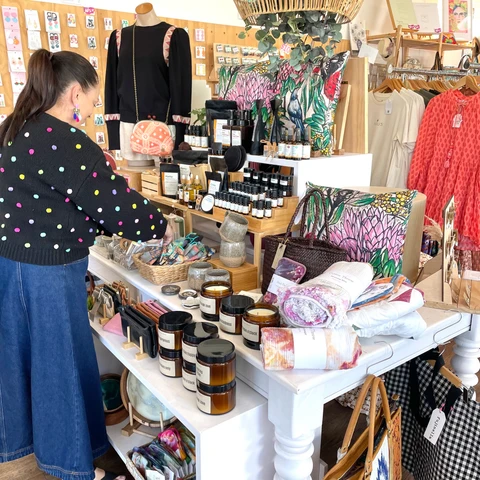 Specialist store owner evaluating small-brand products while considering quality, compatibility, supply, and customer demand.